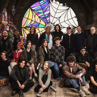 Image from the Wednesday season 2 table read on the Wednesday set: (L to R) Georgie Farmer, Victor Dorobantu, Luyanda Unati Lewis-Nayo, Joy Sunday, Owen Painter, Emma Myers, Billie Piper, Jenna Ortega, Evie Templeton, Luis Guzmán, Isaac Ordonez, Catherine Zeta-Jones, Alfred Gough, Noah Taylor, Miles Millar, Tim Burton, Steve Buscemi, Moosa Mostafa, Hunter Doohan on the set of Wednesday season 2. Cr. Helen Sloan/Netflix © 2024